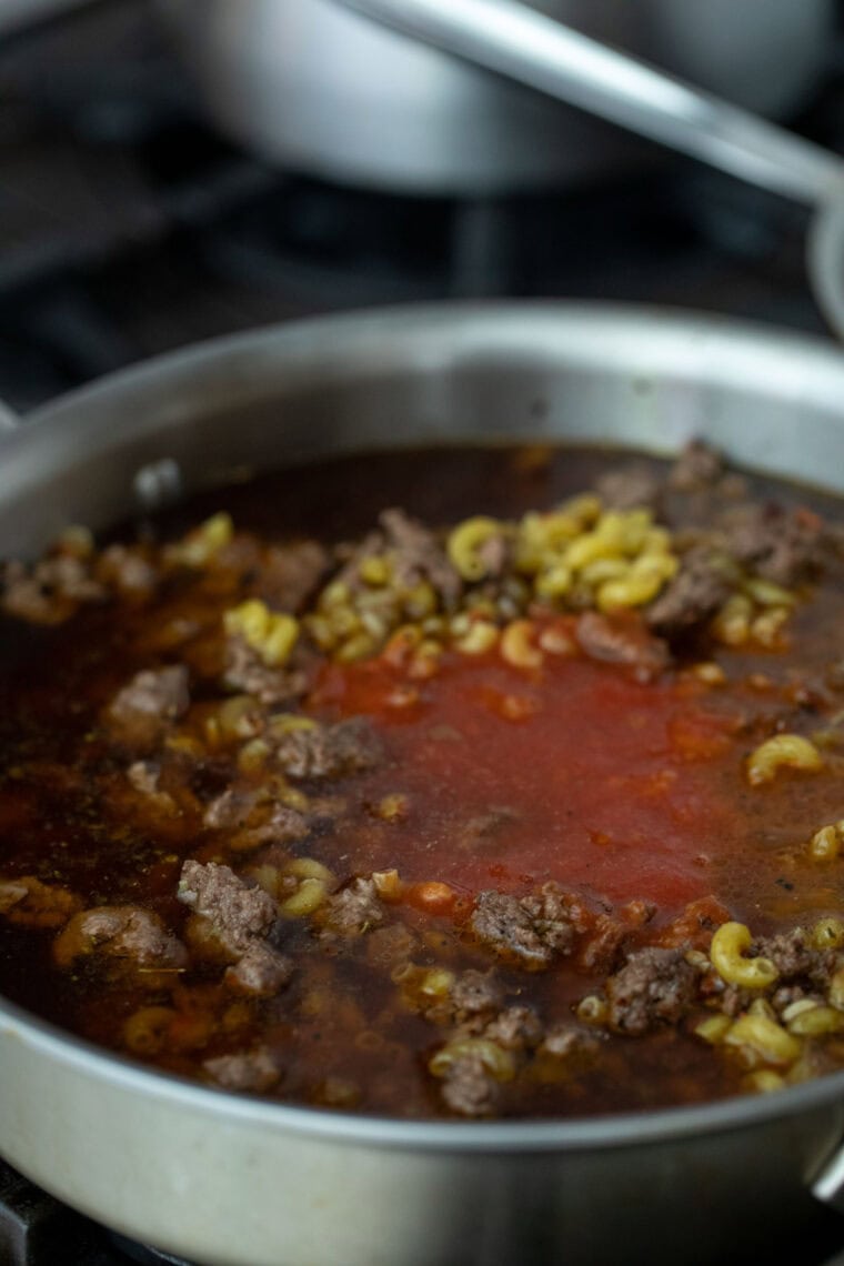 Simmering the mac and cheese.