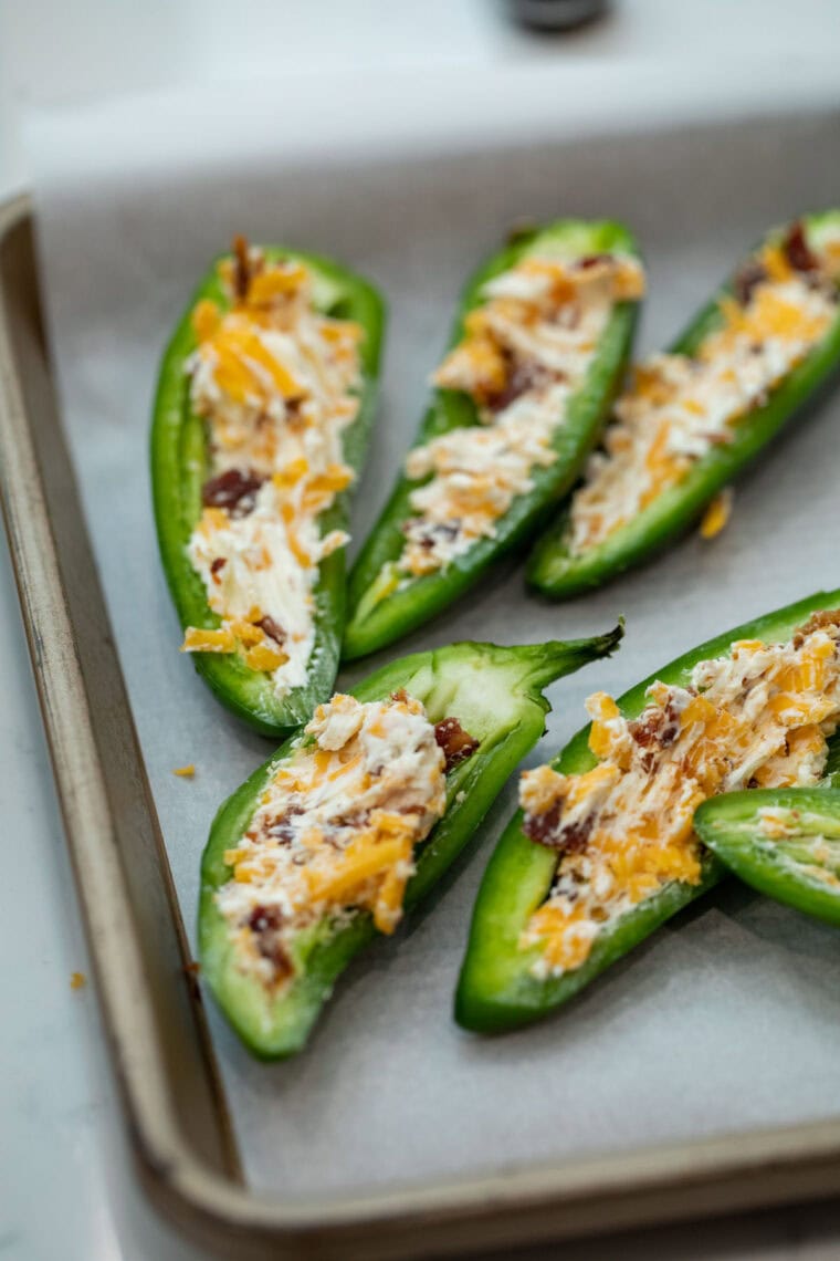 Filling the jalapenos.