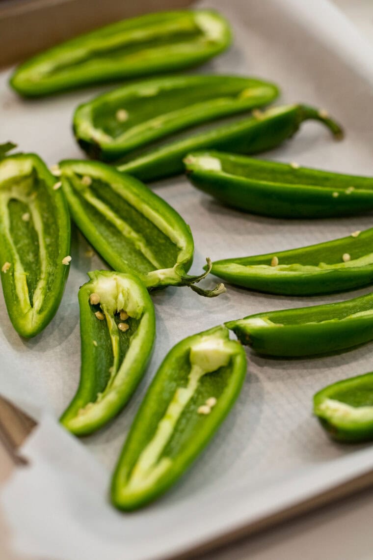 Hollowing out jalapenos for appetizers.