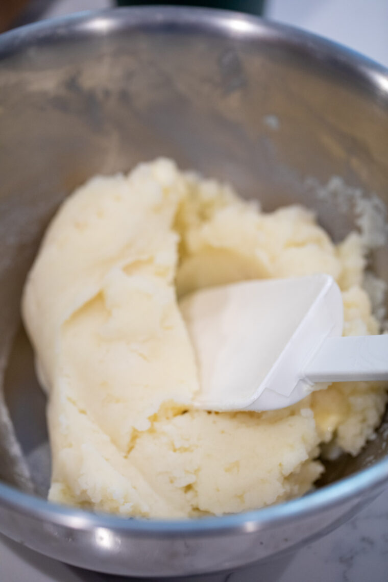 Butter added to mashed potatoes.