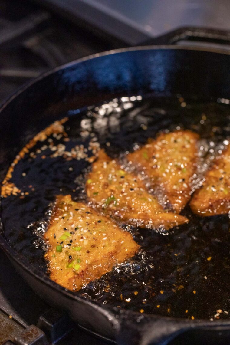 Frying the crab toasts.